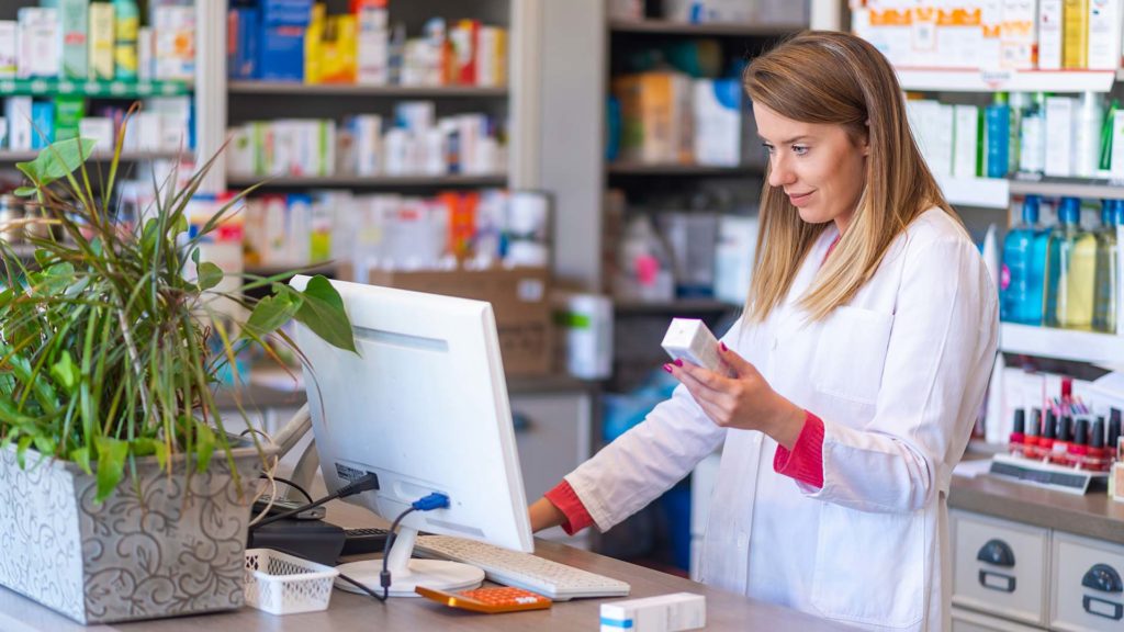 Pharmacist using Meridian Retail EPoS